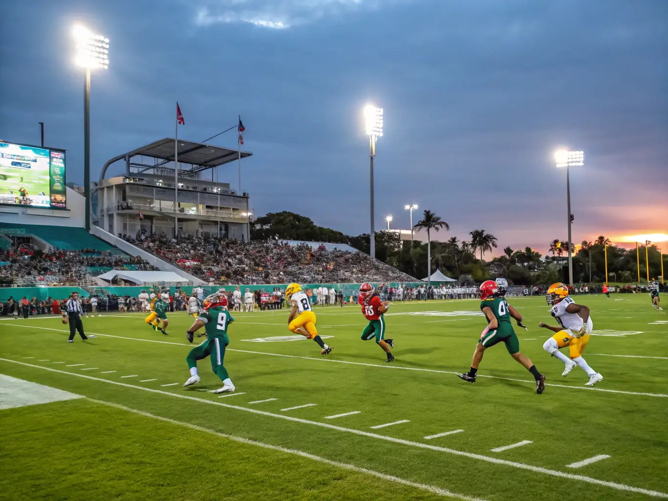 A dynamic shot of a football match in progress, capturing the intensity and excitement of the game, with players in action and spectators cheering from the sidelines.