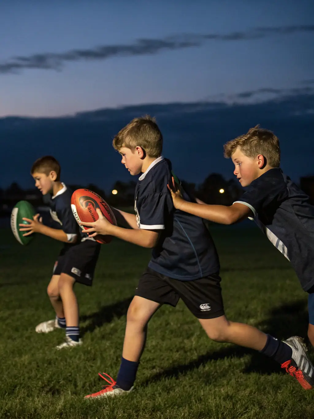 Image of teenage football players, aged 13-15, engaged in a tactical training drill at PLANCOET ARGUENON FOOTBALL CLUB, emphasizing teamwork and strategic play.